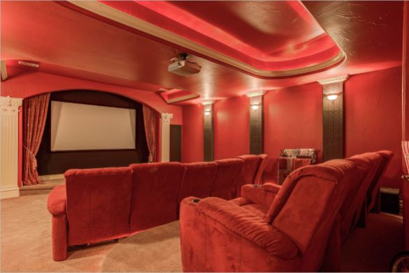 a red theater room in a home for sale